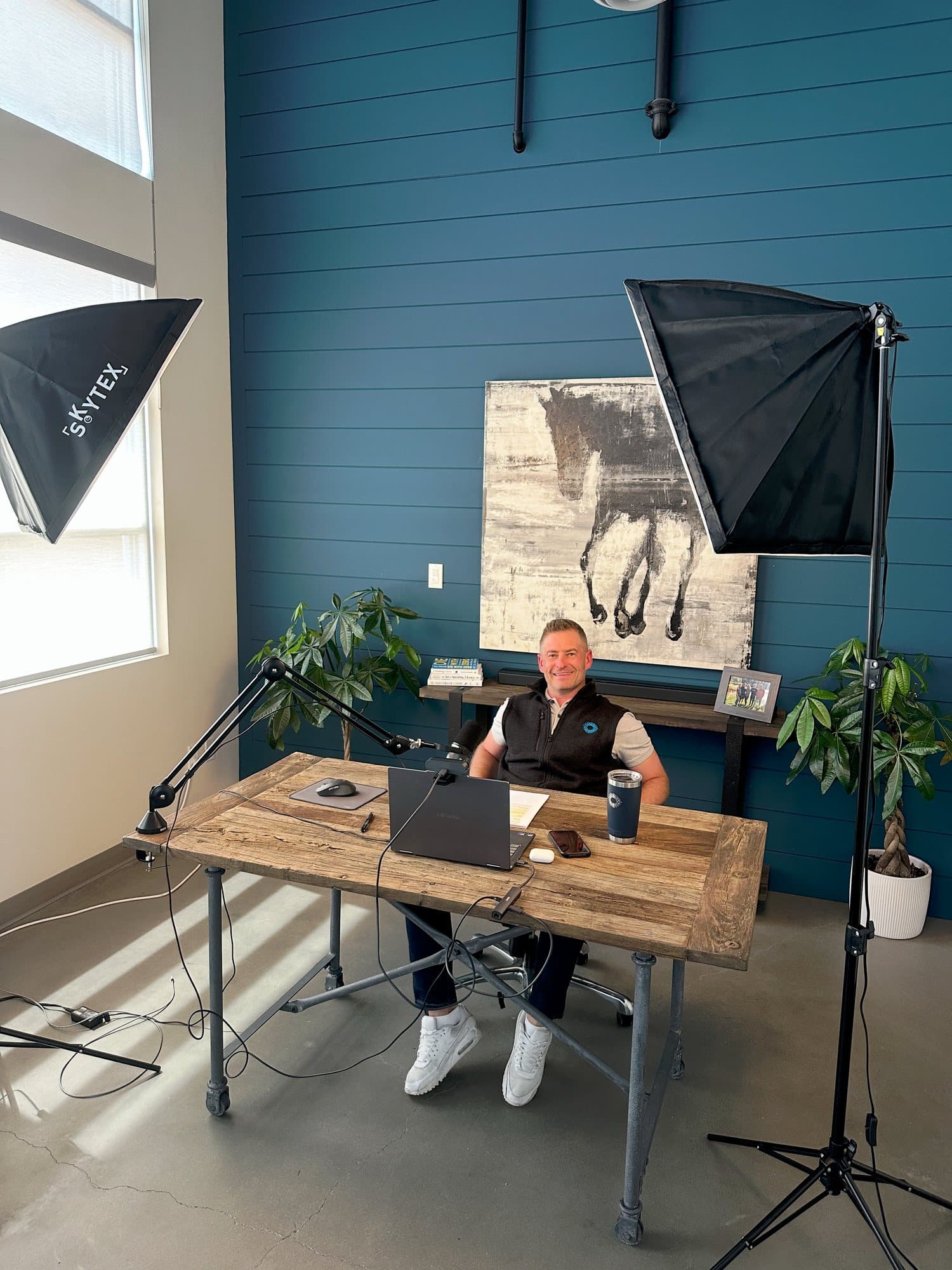 Shea Sanche at his desk in the studio
